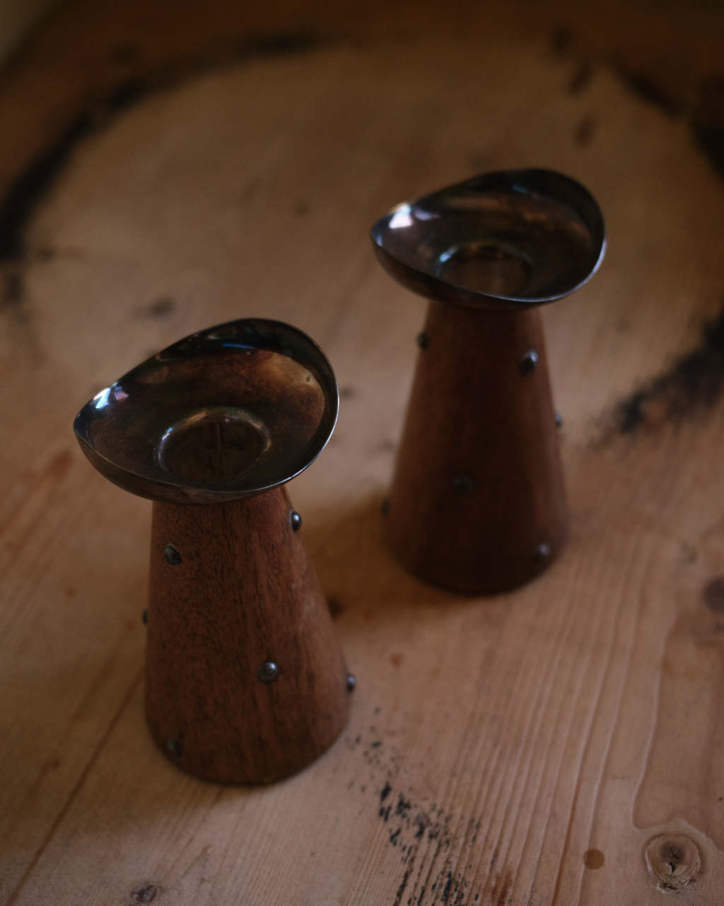 X HANS JENSEN. Pair of teak and silver-plated candlesticks