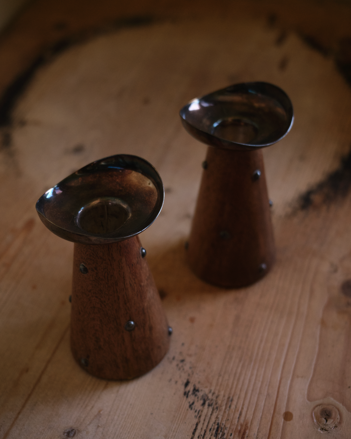 X HANS JENSEN. Pair of teak and silver-plated candlesticks