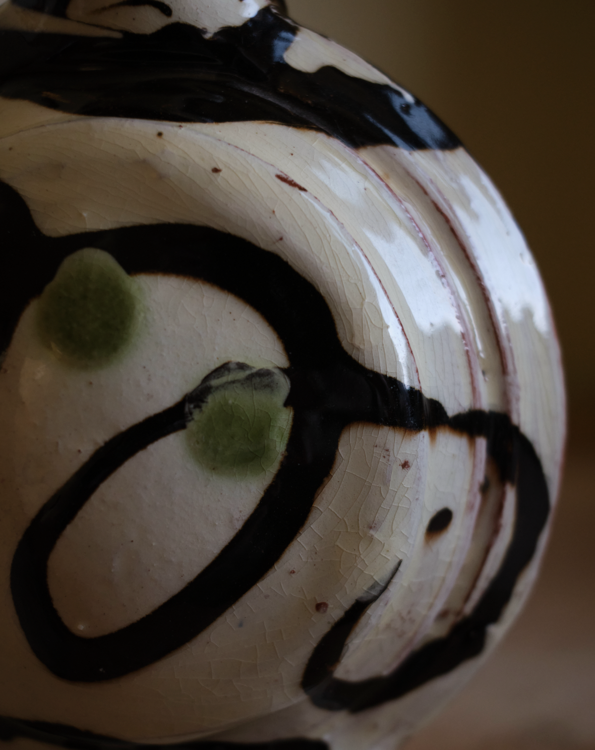 X DYLAN BOWEN slip decorated earthenware bottle